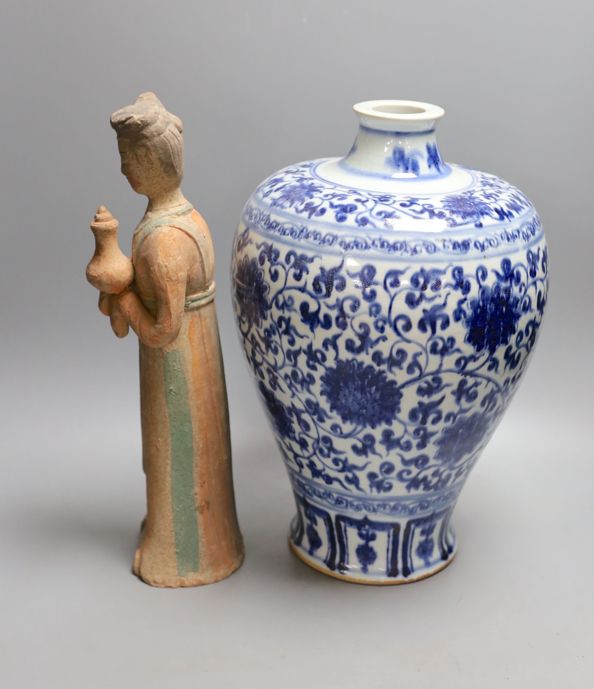 A large Chinese blue and white meiping and a Tang style pottery figure (2), vase 37 cms high.